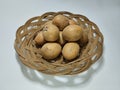 pile of sapodilla on top of the basket Royalty Free Stock Photo