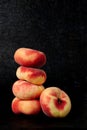 Pile of saturn peaches isolated over black