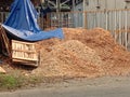 A pile of sawmills. Piled up on the side of the road.