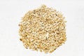 Pile of scagliola canary seeds close up on gray Royalty Free Stock Photo