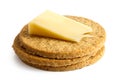 Pile of Scottish oatcakes with a slice of yellow cheese.