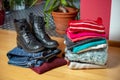 Pile of second hand clothing and shoes on floor