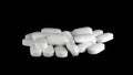 Pile of Sertraline 100mg pills on black background