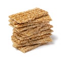 Pile of sesame snaps white background close up