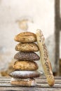 Pile of Several small multi grain different shaped bread and baguette,sprinkled with whole sunflower seeds, flax and