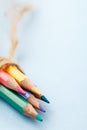 Pile of sharp coloured drawing pencils on table