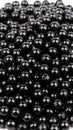 Pile of shiny black spheres against a white background, abstract texture Royalty Free Stock Photo
