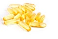 Pile of shiny yellow capsule vitamin isolated