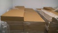 Flat cardboard boxes in stock. A pile of shipping boxes