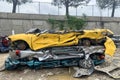 Pile of shredded cars to be shredded at a recycling plant, stack of automobiles after road accidents Royalty Free Stock Photo