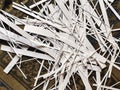 Pile of shredded photo paper after being cut, waste of white paper document, paper strips Royalty Free Stock Photo