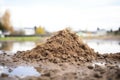 pile of silty soil near a river or lake showing its smooth texture Royalty Free Stock Photo