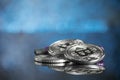 Pile of silver bitcoin cryptocurrency coins with purple digital Royalty Free Stock Photo