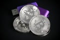 Pile of silver bitcoin cryptocurrency coins with purple digital Royalty Free Stock Photo