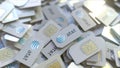 Pile of SIM cards with AT&T Inc. logo, close-up. Editorial telecommunication related 3D rendering