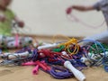 Two children untangling knotted skipping ropes