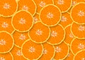 Pile of sliced orange fruits texture abstract background