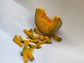 Pile of Sliced pumpkin on white background. Closeup Pumpkin Frame for text placement in a white backdrop