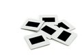 Pile of slides with frames on llightbox. Royalty Free Stock Photo