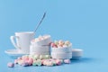 Pile of small colorfull marshmallow on blue background in bowl Royalty Free Stock Photo