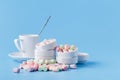 Pile of small colorfull marshmallow on blue background in bowl Royalty Free Stock Photo