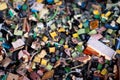 A pile of small generic electronic waste painted on top with different colors and textures