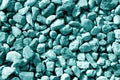 Pile of small gravel stones in cyan tone. Royalty Free Stock Photo