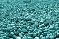 Pile of small gravel stones in cyan tone Royalty Free Stock Photo