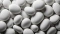 Pile of Smooth White Oval Shaped Stones or Pebbles with Soft Lighting and Shadows 589 Royalty Free Stock Photo