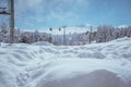 pile of snow with cable car in the far Royalty Free Stock Photo