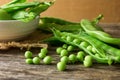 Pile of snow peas on wood background Royalty Free Stock Photo