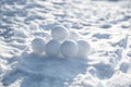 Pile of snowballs outdoors on sunny winter day