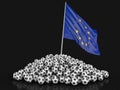Pile of Soccer footballs and Europian Union flag