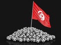 Pile of Soccer footballs and Tunisian flag