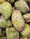 A pile of soursop fruit, commonly known as \