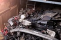 A pile of spare parts at a car service warehouse with different units of auto iron-plastic on the lower rack at an auto-parsing or Royalty Free Stock Photo