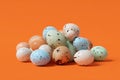 A pile of speckled mini Easter eggs sit together. Royalty Free Stock Photo