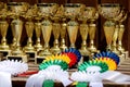 Pile of sport trophies and badges rosettes for the winners on show jumping competition