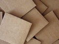 Pile of square pieces of cardboard close up