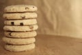 Pile or stack of choc chip and fruit cookies, on a wooden table Royalty Free Stock Photo