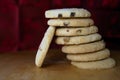 Pile or stack of choc chip and fruit cookies, on a wooden table Royalty Free Stock Photo