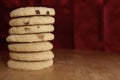 Pile or stack of choc chip and fruit cookies, on a wooden table Royalty Free Stock Photo
