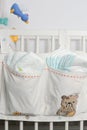 Pile or stack of diapers in baby bed hanging storage bag