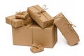 Pile of stacked boxes wrapped with brown kraft paper and tied with twine on a white background. Delivery, moving concept Royalty Free Stock Photo