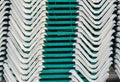 Pile of stacked green sunbeds summer season beach lounge background pattern Royalty Free Stock Photo