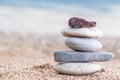 Pile of stacked stones on the sandy beach at Adriatic sea Royalty Free Stock Photo