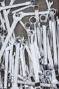 Pile of stainless steel wrench on table