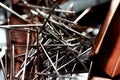 A pile of stapler staples and nickel plated steel pins, stack of paper pin background, a closeup of office pins Royalty Free Stock Photo