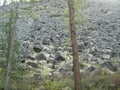 A pile of stone scree or kurumnik on the slope in the Eastern Sayan