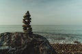 Pile of stones on a big rock at a sunny beach of the baltic sea